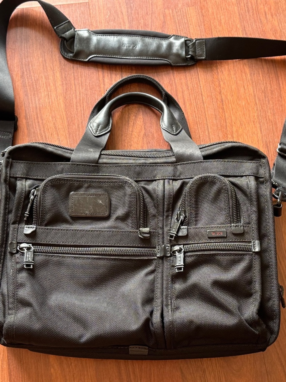 Tumi Alpha series briefcase --models often include 26141DH or similar
